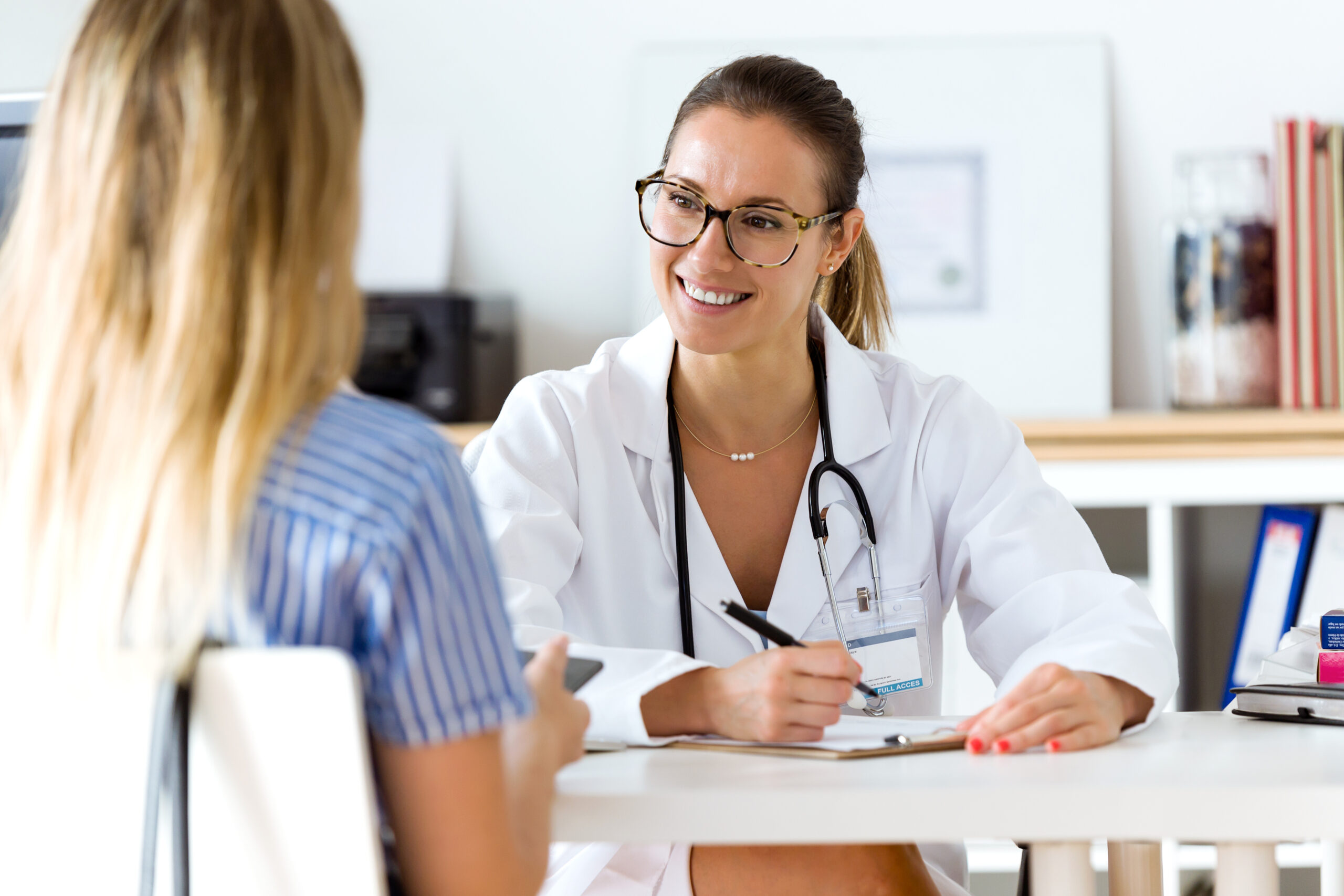 Female Doctor Explaining Diagnosis To Her Patient.